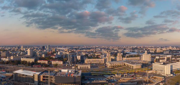 High angle view of city buildings during sunset