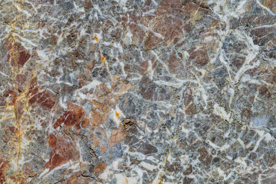 Full frame shot of rocks on tiled floor