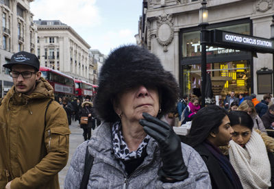 Portrait of people in city during winter