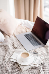 High angle view of coffee cup on table