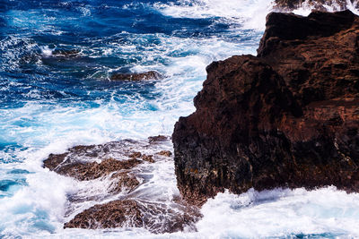 Waves splashing on rocks