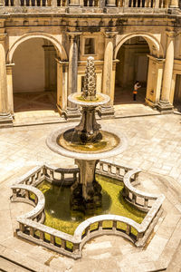 Fountain in front of historical building