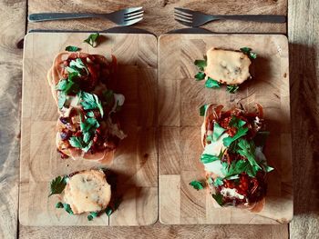 High angle view of pizza on cutting board