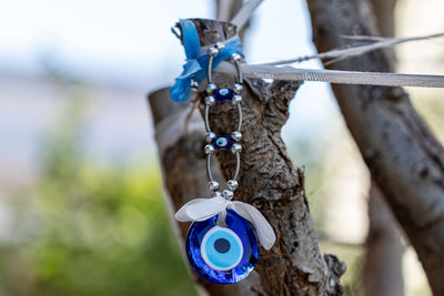 Close-up of dreamcatcher hanging outdoors