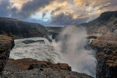 Beautiful foggy cascades of gullfoss waterfall in golden circle during sunset