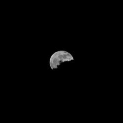 Low angle view of moon against sky at night