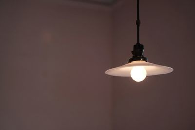 Low angle view of lit lamp