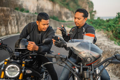 Man riding motorcycle on road