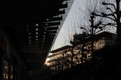 Low angle view of buildings against sky at night