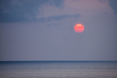 Scenic view of sea against sky at sunset