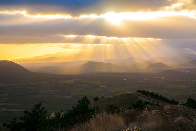 Scenic view of landscape against sky during sunset