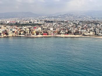 High angle view of beirut townscape by sea against sky