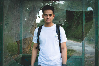 Portrait of young man standing outdoors