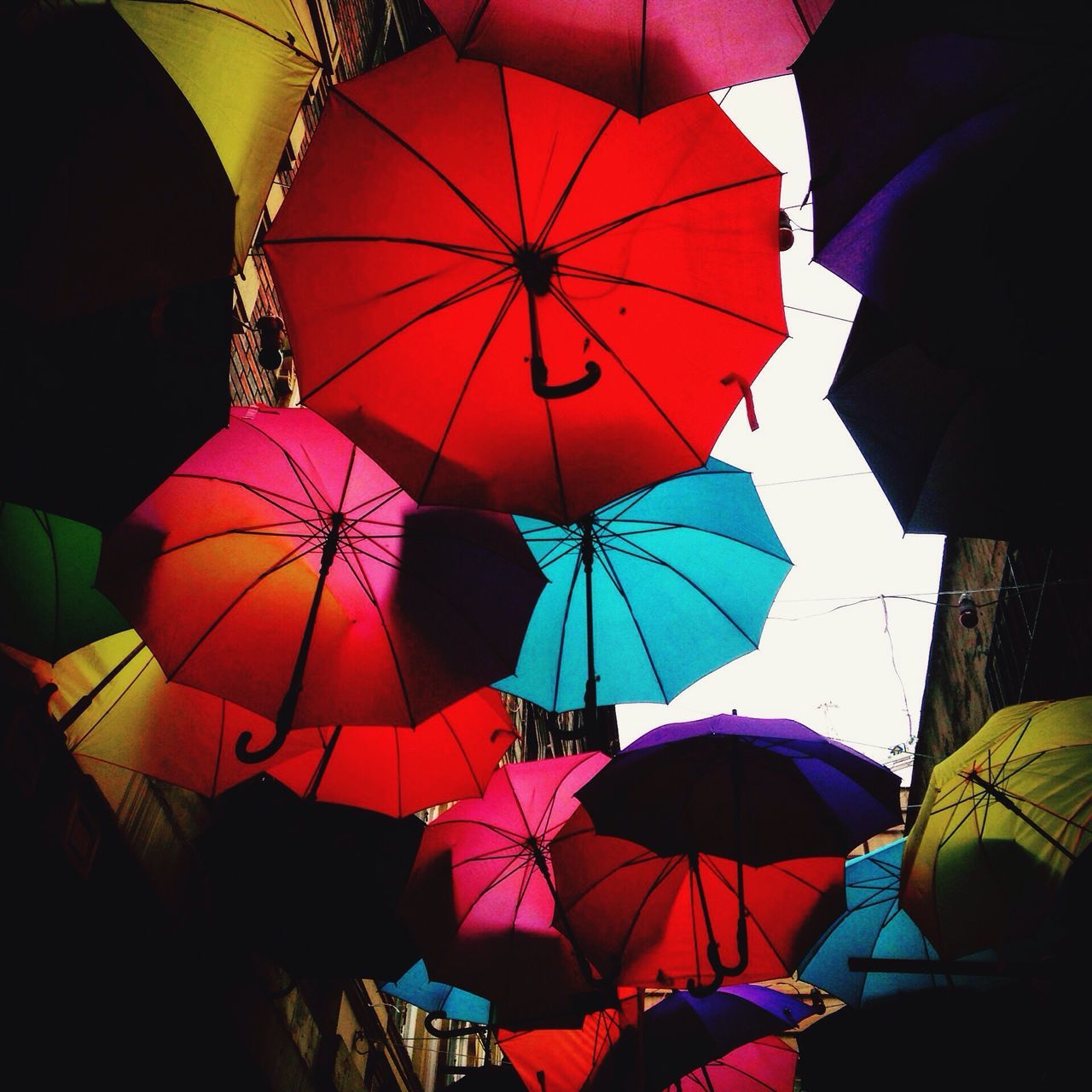 multi colored, umbrella, low angle view, colorful, hanging, celebration, balloon, flag, cultures, pattern, leisure activity, tradition, protection, decoration, outdoors, arts culture and entertainment, patriotism, hot air balloon, traditional festival, variation