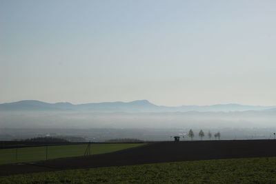 Scenic view of field against clear sky