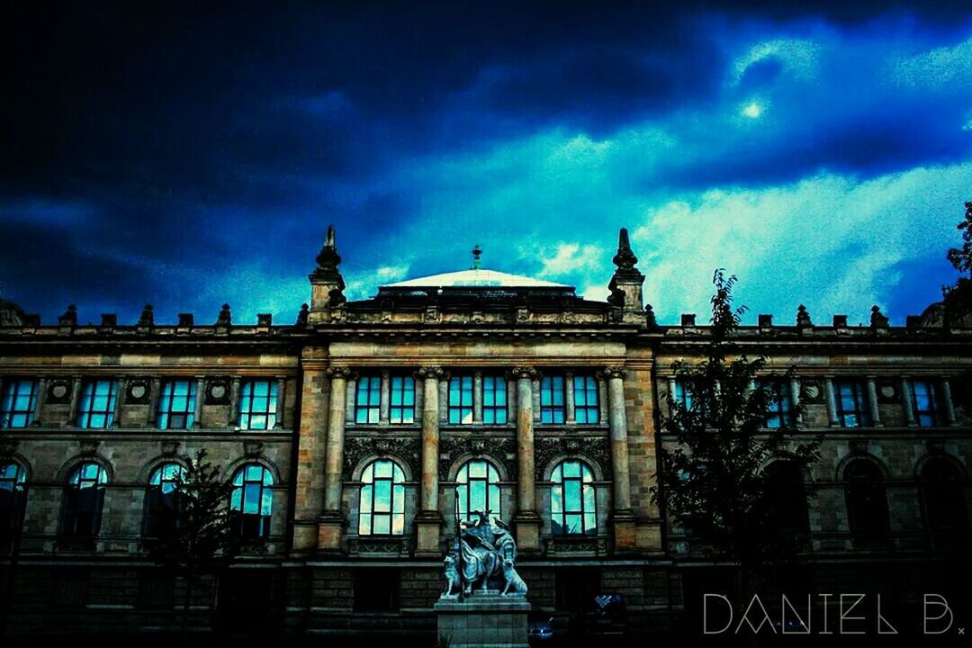 architecture, building exterior, built structure, sky, cloud - sky, low angle view, cloudy, facade, cloud, arch, window, city, building, dusk, illuminated, outdoors, night, history, travel destinations, no people