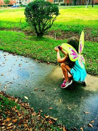 Rear view of girl in park