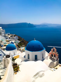 Panoramic view of sea and buildings against sky