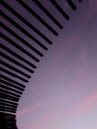 Low angle view of building against sky at sunset