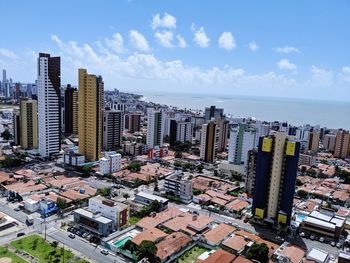 High angle view of city buildings against sky