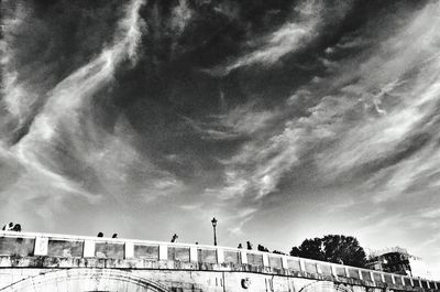 Low angle view of building against cloudy sky