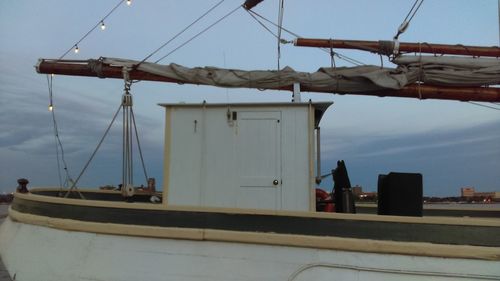 Low angle view of ship on sea against sky