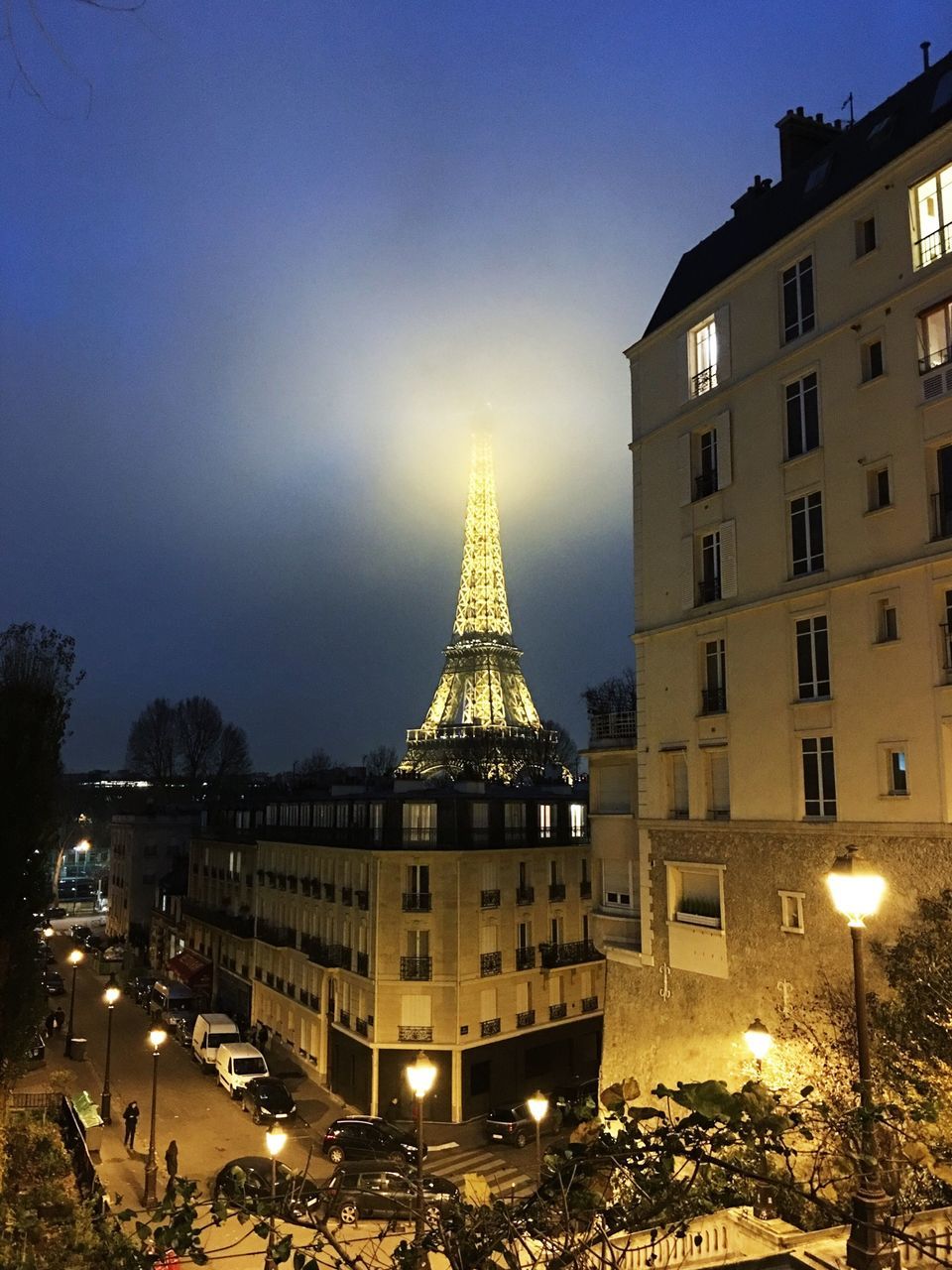 architecture, built structure, building exterior, illuminated, city, sky, famous place, travel destinations, capital cities, international landmark, night, tourism, travel, tower, city life, dusk, street, tall - high, car, outdoors