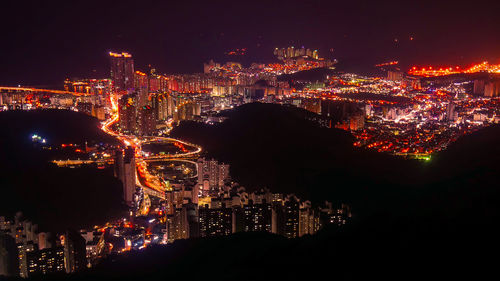 Aerial view of illuminated cityscape at night