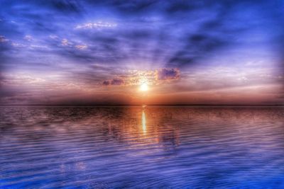 Scenic view of sea at sunset