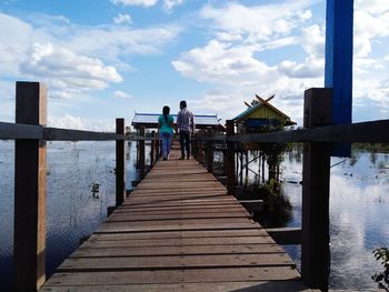 Pier over sea against sky