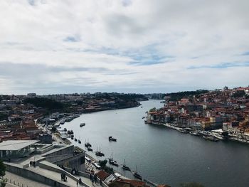 High angle view of river amidst buildings in city