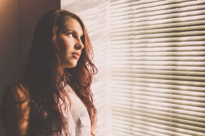 Close-up of young woman at home