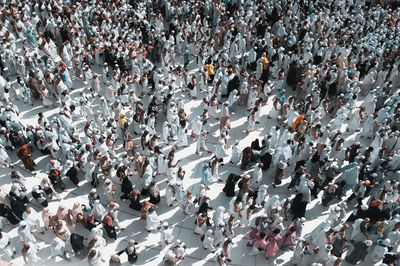 High angle view of people praying outdoors at event