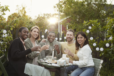 Happy friends having party in garden