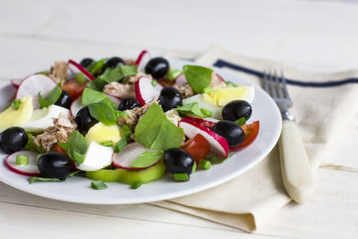 Nicoise salad with tuna, egg, cherry tomatoes and black cuisine