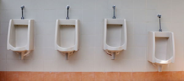 Urinals in public restroom