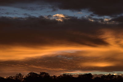 Low angle view of cloudy sky at sunset