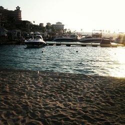 Scenic view of river against sky in city