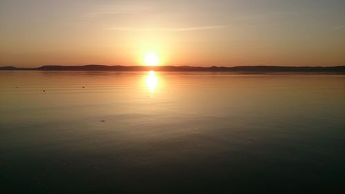 Scenic view of sunset over river