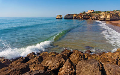 Scenic view of sea against clear sky