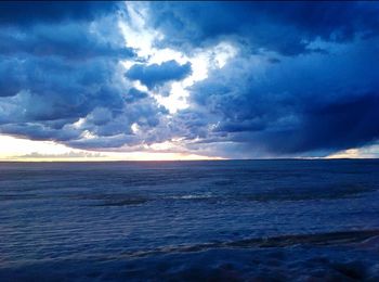 Scenic view of sea against dramatic sky