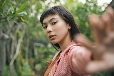 Portrait of young woman looking away