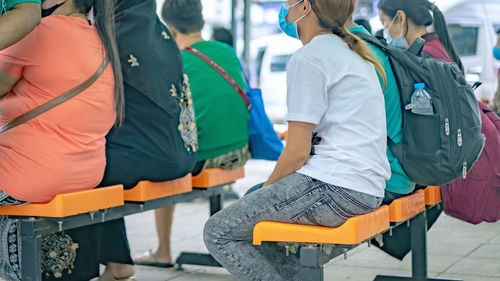 Rear view of people on seat