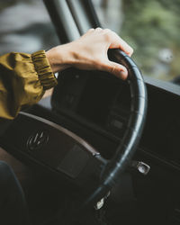 Close-up of hand holding car