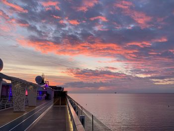 Scenic view of sea against orange sky