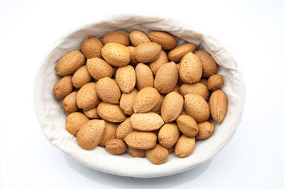Directly above shot of cookies in bowl against white background