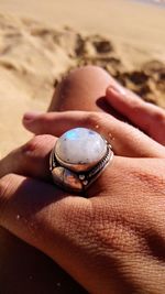 Close-up of hand holding sand