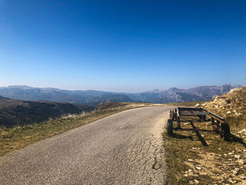 Scenic view of mountains against clear blue sky