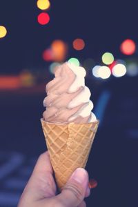 Cropped image of hand holding ice cream