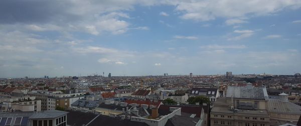 Aerial view of cityscape against sky